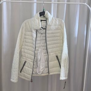 White puff jacket.